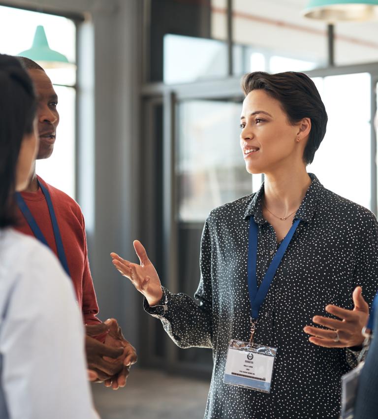 Group of professionals talking in an office