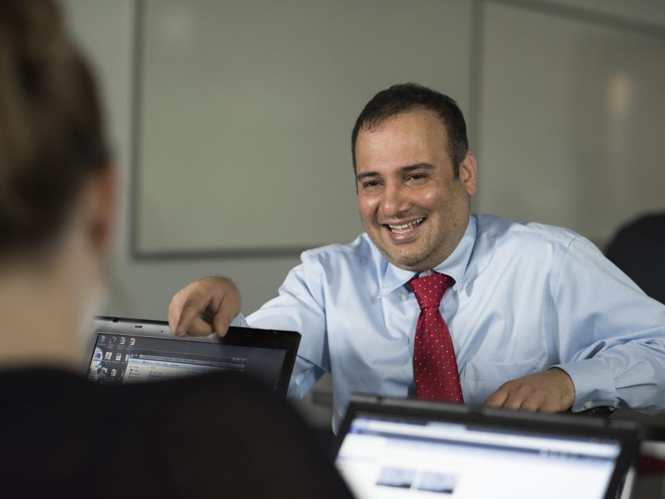 Teacher smiles at student