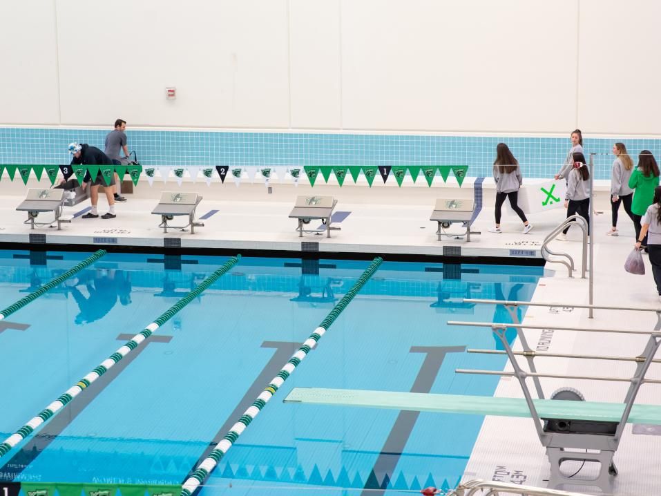 students gathering around pool for Cardboard Boat Regatta