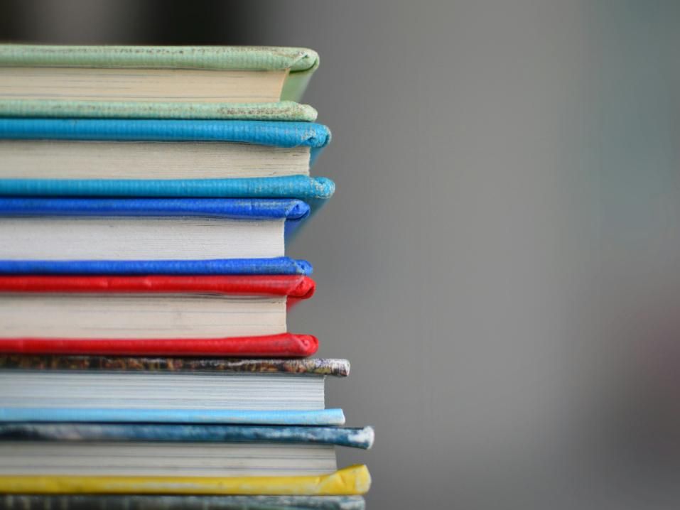 A stack of books with bright covers.