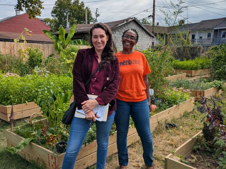 Jess Zartman, Director of the Urban Collaborative, and community partner Ms. Darlene at the Northeast Neighborhood Association Community Garden.