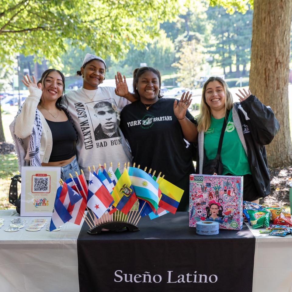 Four members of Sueno Latina work at their club table during Student Involvement