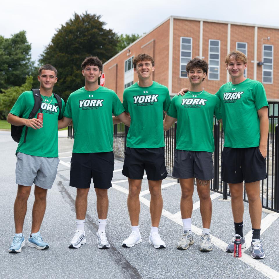 A group of 5 York College soccer players pose for a photo.