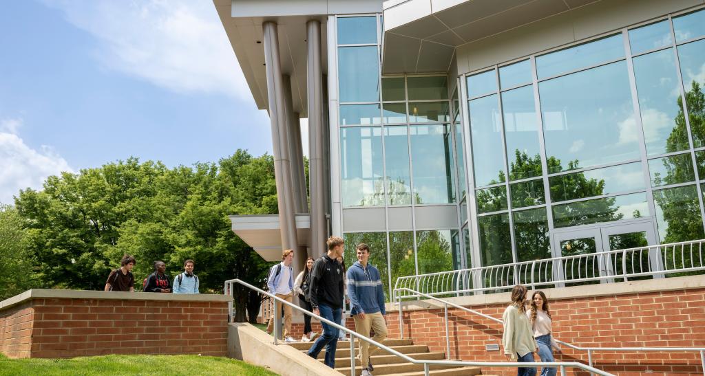 Outside of the Waldner Performing Arts Center with students walking up and down the steps