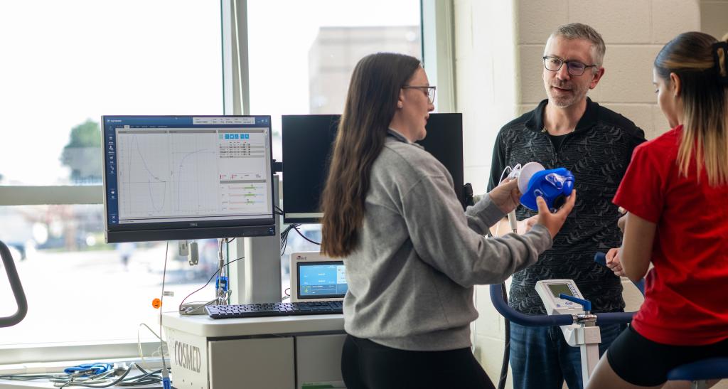 Students and a professor in the new Exercise Science lab.