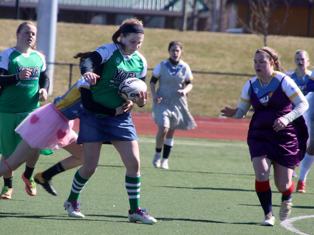 The Women's Rugby team in an active play. 