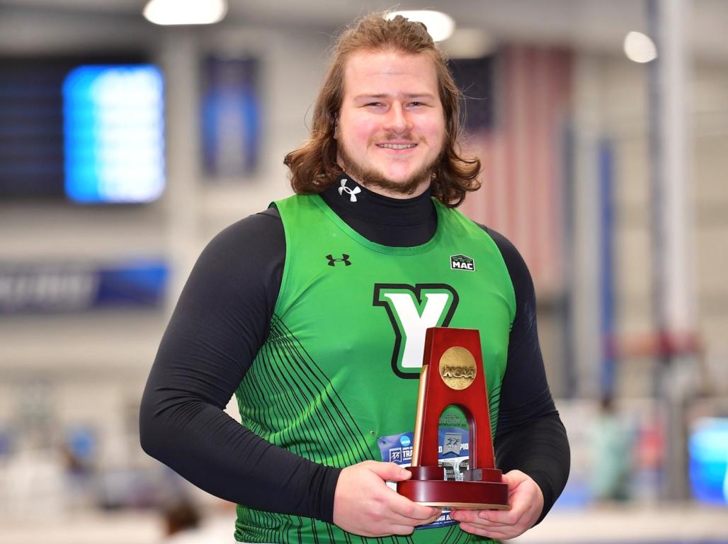 Andrew Mott poses holding his seventh place trophy in the 2024 NCAA Division III Indoor Track and Field Championships.