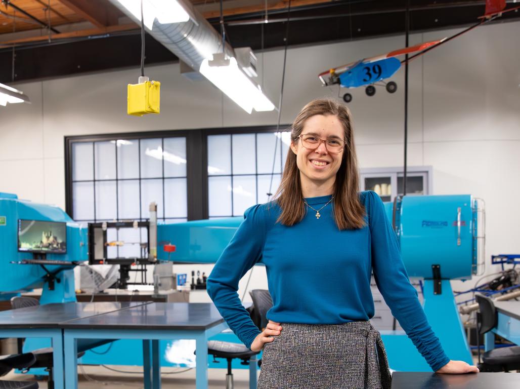 Ashley Earle standing in a Mechanical Engineering Lab.