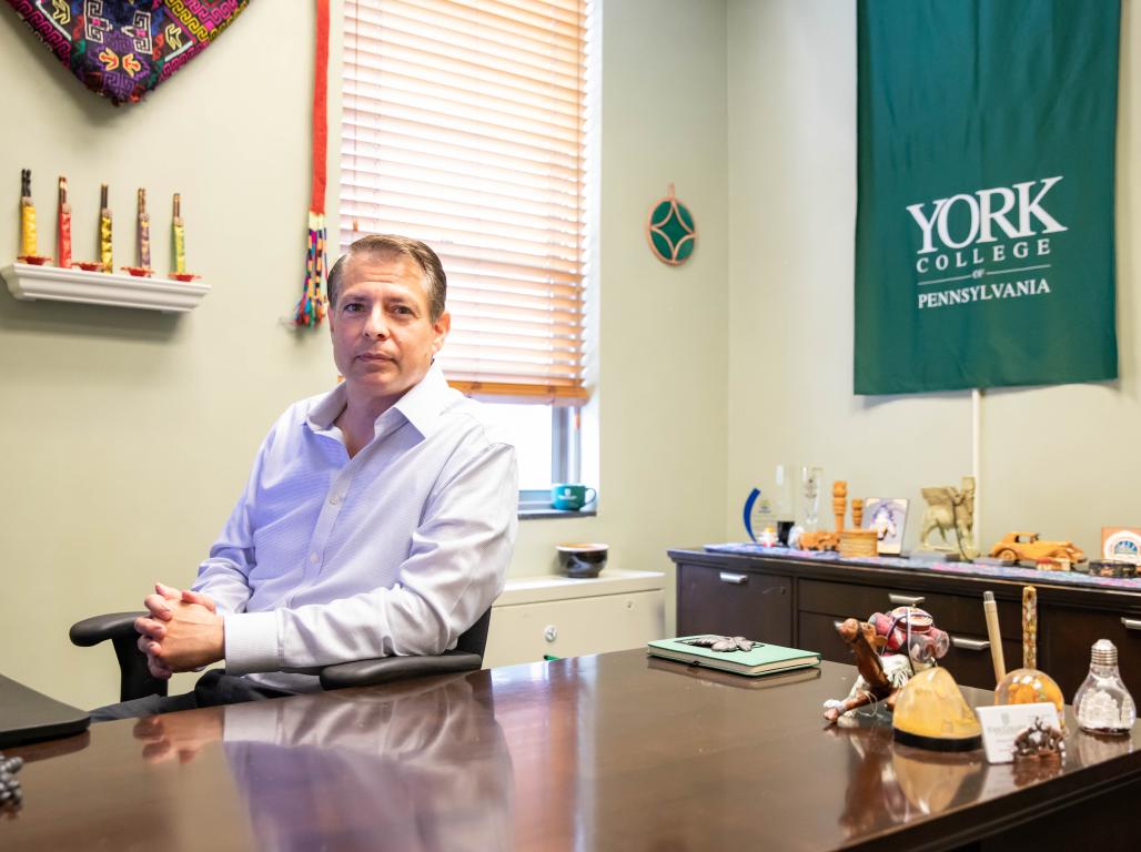 Christian DeGregorio sitting at desk