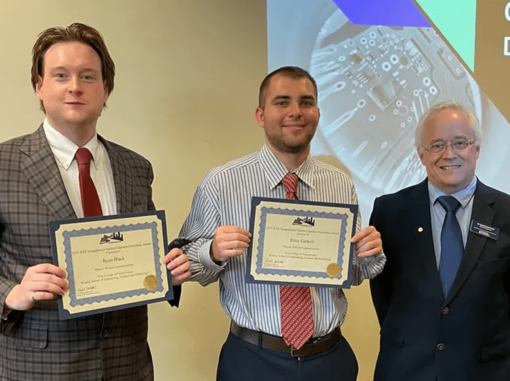 Ryan Black, Riley Gartrell, and Harold Underwood pose for a photo with their certificates.