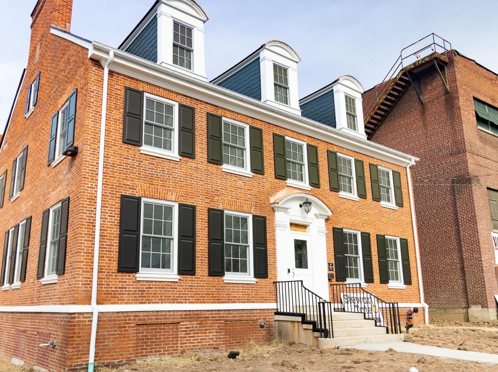 An exterior photo of the Mill House at the Knowledge Park features brickwork and colonial-style architecture.