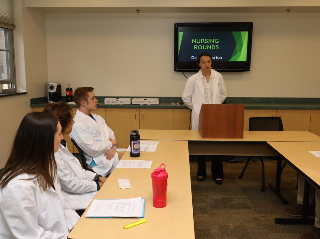 Nursing Students in a classroom paying attention while the professor is speaking