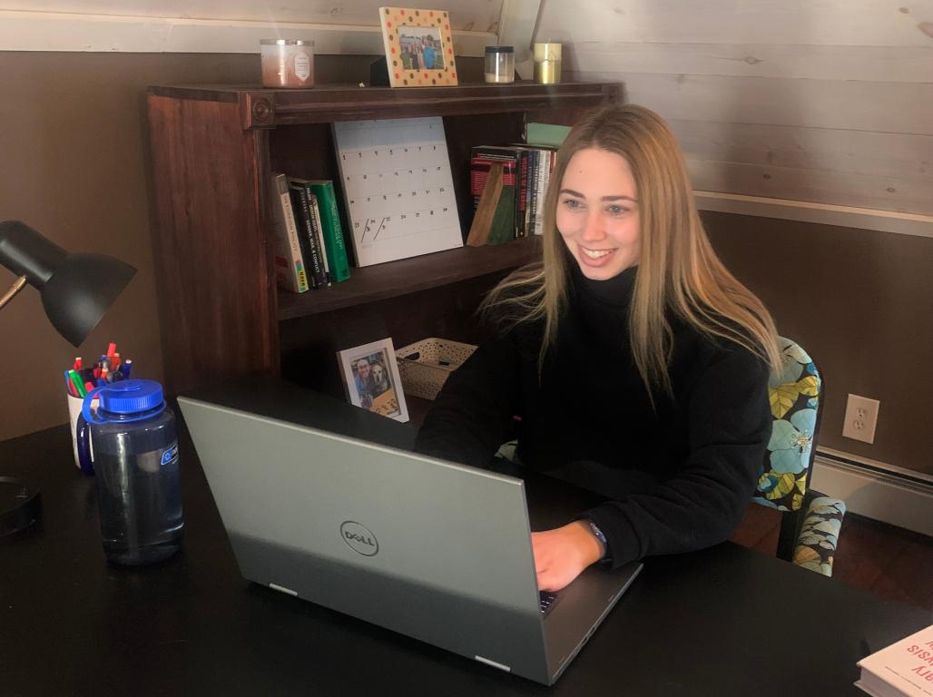 Rebekah Dodson works at a laptop in a home office.