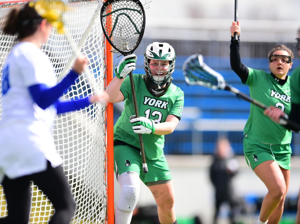 Bella Garabo playing as goalie on the field during a game.