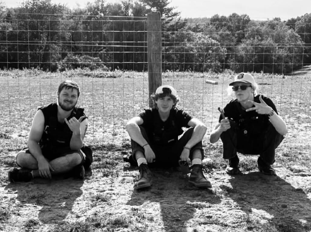 Three individuals smile on the set of "Maybe We Should" on YCP's campus.