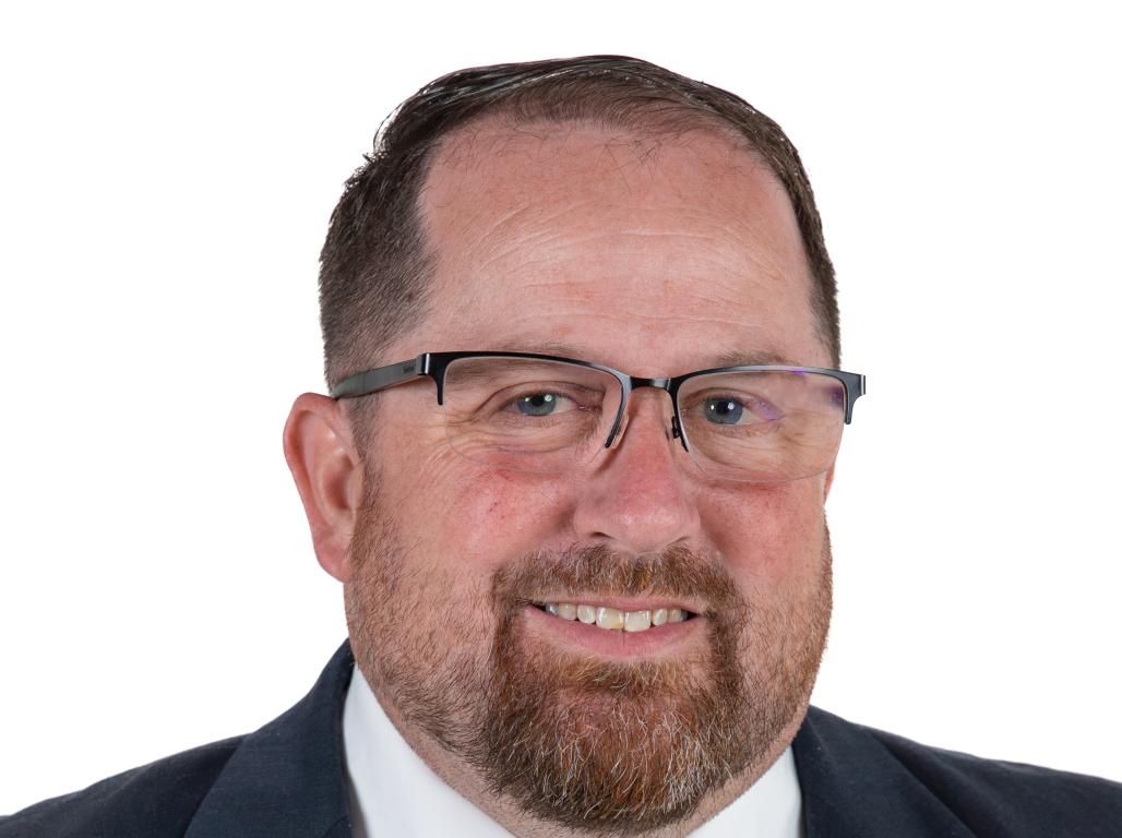 Professional headshot of Kevin Feil