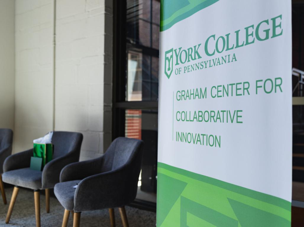 Two chairs and a sign for the York College GCCI