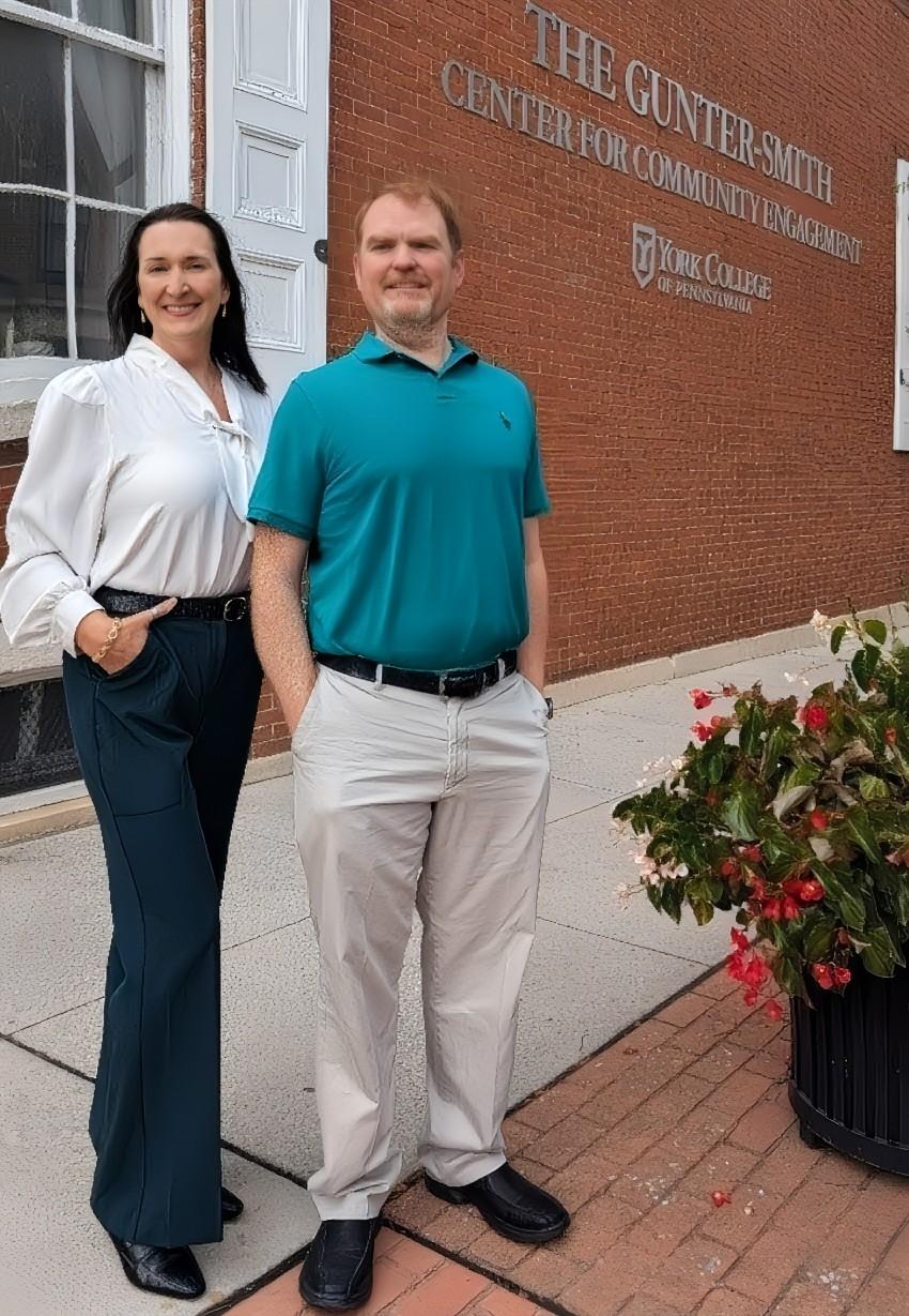 Dr. Klaudia J. Cweikala-Lewis and Brandon Parkyn in front of the CCE Building.