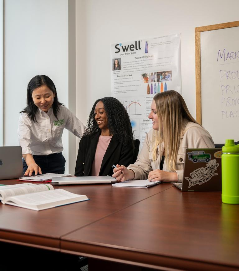 Professor helps students out with their work