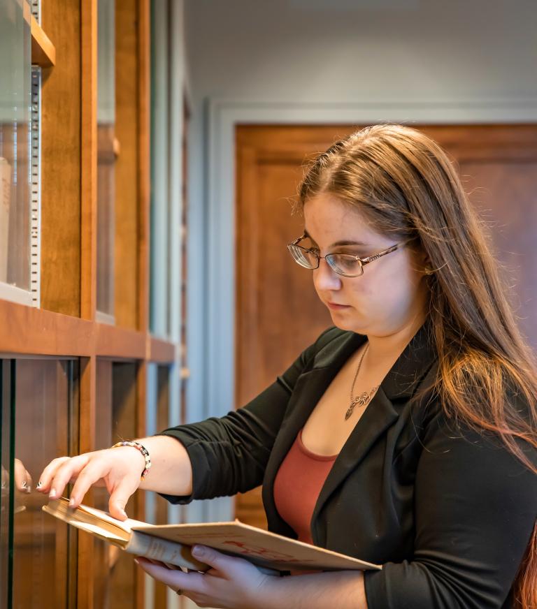 A student is looking through a history book