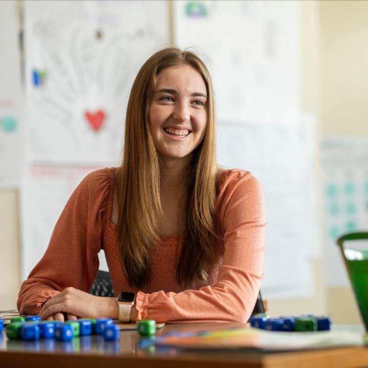 A student teaching in a classroom.