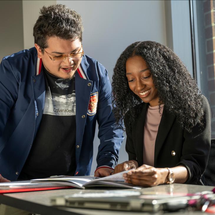 2 students studying together.