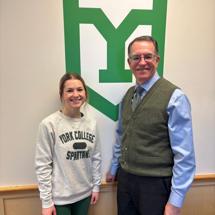 York College junior nursing major Sydney Yohe stands with President Dr. Thomas Burns
